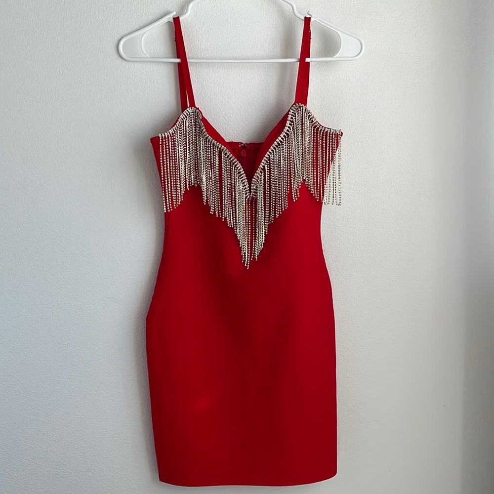 Bright red, mini dress with adjustable straps. Never been worn